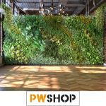 Crafted Canvas Creations: Bespoke Custom Backdrops by PW Shop. A floral almost hedge like backdrop in a room with a wooden floor. PW Shop logo is also shown.