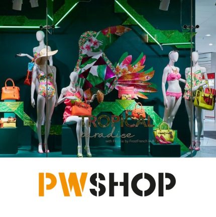 Tropical Display for clothing items in a store window. PW Shop logo is at the bottom.