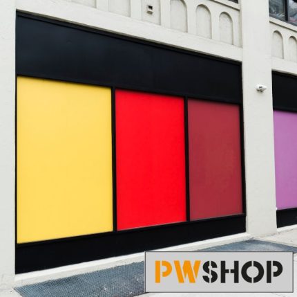 A multicoloured window display. The PW Shop logo is also shown.