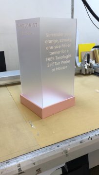 An Elegance Series Plinth made by PW Shop for Tanologist. Transparent custom bespoke plinth ready for product display.