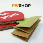 Two red 'Sweetheart Stand' popup decorations folded down and stacked on each other. PW Shop logo is also visible.