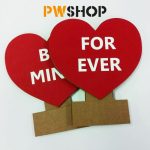 Two red 'Sweetheart Stand' decorations folded down and laying flat on top of each other. Text says 'Be Mine' and 'Forever'. PW Shop logo is also visible.