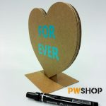 A plain cardboard 'Sweetheart Stand' pop up decoration with 'Forever' written on it. Black sharpie next to it. PW Shop also visible.